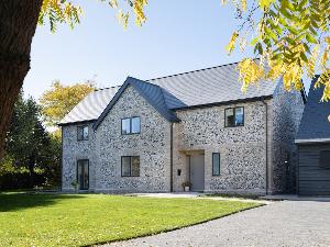 The flint work faces the village in all its glory on this new build south of Cambridge.