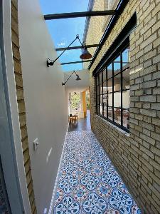 Once an outside passage, this space was integrated internally, but the tiles, brickwork and roof light helped keep an outdoor feel on this central Cambridge Victorian terrace house refurbishment.